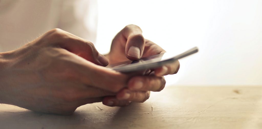 Hands holding a phone for digital activism