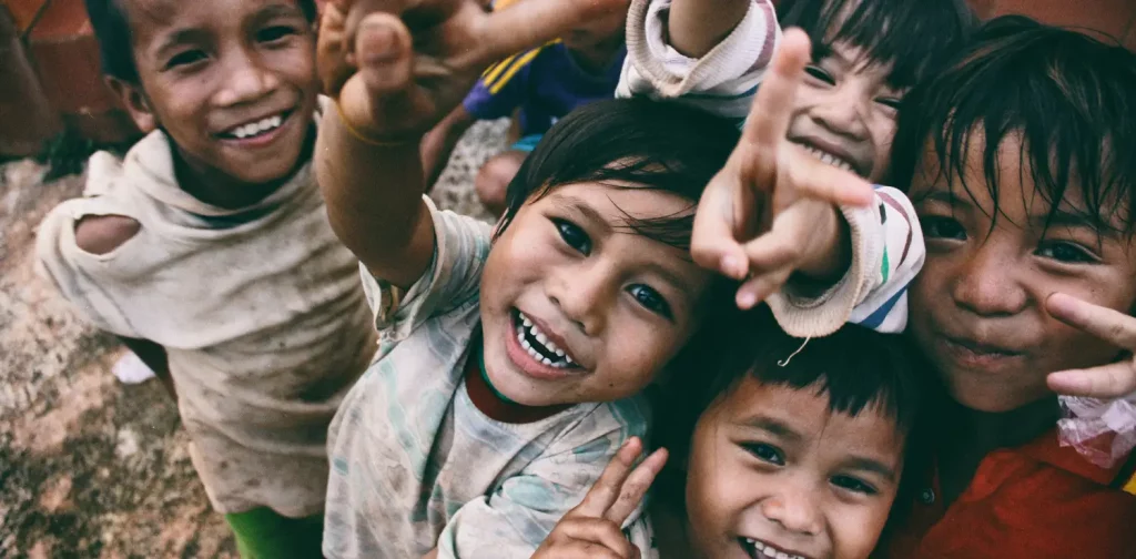 five children smiling at the camera